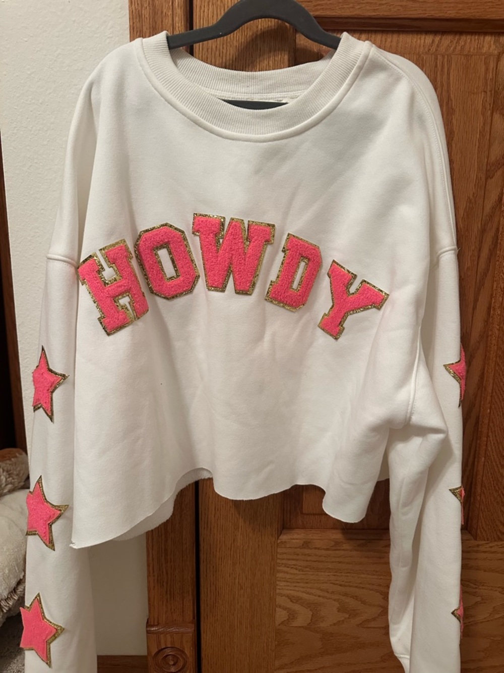 White Sweatshirt with Pink 'HOWDY' Lettering and Stars